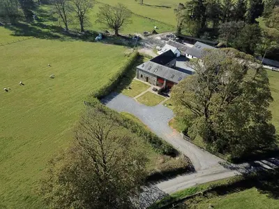 an aerial view of a house in a field at Peregrine Stable Cottage in Llandovery