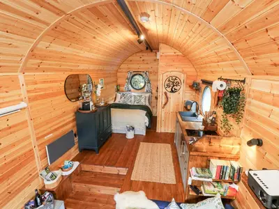 an overhead view of a bedroom in a tiny house at The Kites Nest in Ystrad Meurig
