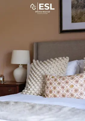 a bedroom with a bed with a pillow and a lamp at Large Country Farmhouse, Shropshire Hills View, with Hot Tub in Minsterley
