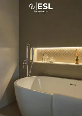 a bath tub with a faucet in a bathroom at Large Country Farmhouse, Shropshire Hills View, with Hot Tub in Minsterley