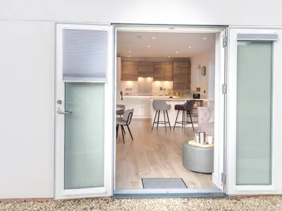 an open door to a kitchen and a living room at Contemporary Apartment with Secure Parking - Pass the Keys in Shrewsbury