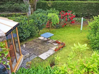 an overhead view of a garden with a table in the grass at Cysgod Y Coed in Llanbedr