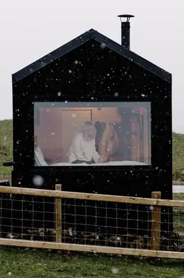 a man and a woman are sitting in a box at Vega in Llangollen