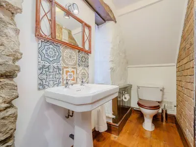 a bathroom with a sink and a toilet at The Druids in Corwen
