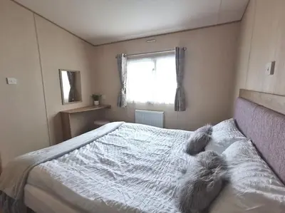 a bedroom with two stuffed animals laying on a bed at Hiking in Snowdonia? Sea, beach and mountains view in Llwyngwril