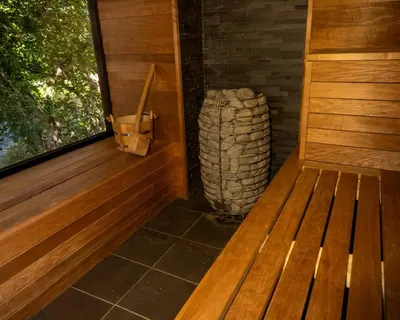 a wooden bench in a room with a window at The Boatshed at Camp Plas in Welshpool