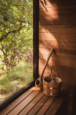 a basket and two spoons sitting on a window sill at The Boatshed at Camp Plas in Welshpool