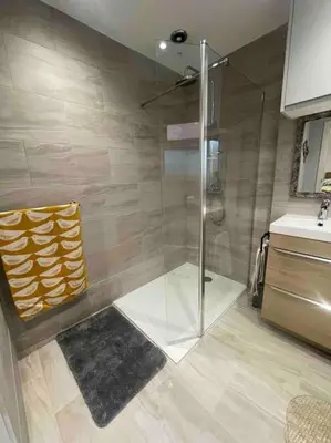 a shower with a glass door in a bathroom at Branlea - In the Heart of Ludlow in Ludlow