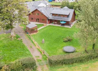 an aerial view of a house with a large yard at Poplar Tree Eco Lodge in Brecon