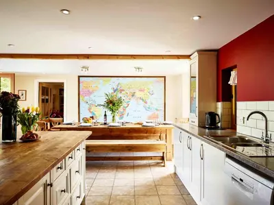 a large kitchen with a large map on the wall at Sycamore Tree Barn in Brecon