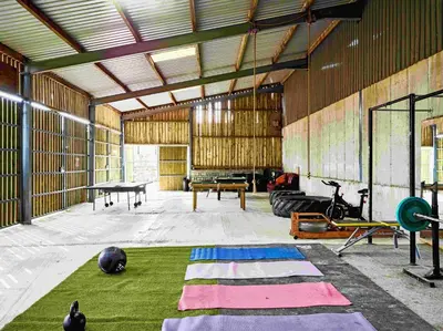 a large room with mats on the floor of a gym at The Flying Scotsman Shepherd's Hut with Hot Tub in Brecon