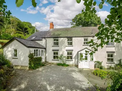 an exterior view of a house with a driveway at 4 Bed in Corwen oc-88868 in Corwen