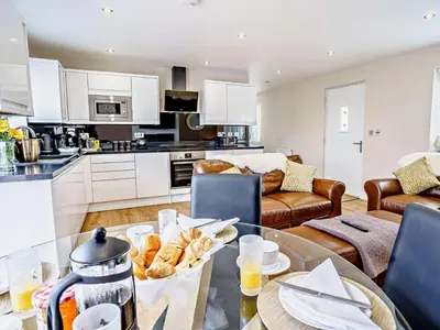 a kitchen and living room with a table with food on it at 2 Bed in Lampeter oc-75211 in Mydroilin
