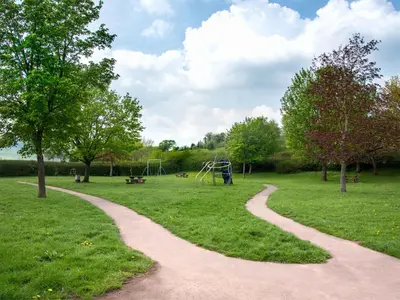 a winding path in a park with a playground at 2 Bed in Battle BN077 in Llandefaelogfâch