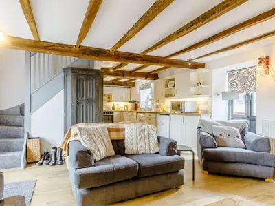 a living room with a couch and a kitchen at 2 Bed in Brecon oc-bn310 in Cray