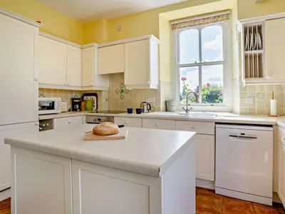 a kitchen with white cabinets and a counter top at 3 Bed in Brecon oc-bn134 in Brecon