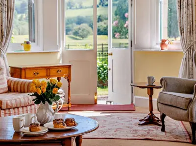 a living room with a table with food on it at 3 Bed in Brecon oc-bn134 in Brecon
