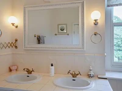 a bathroom with two sinks and a mirror at 3 Bed in Brecon oc-bn134 in Brecon