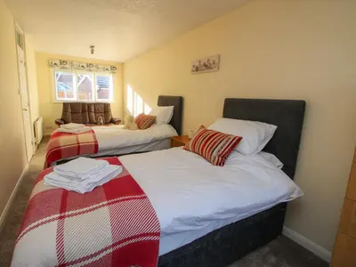 two beds in a small room with at Ludlow House in Ludlow