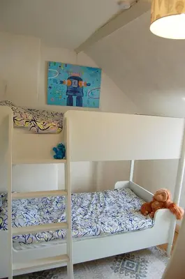 two bunk beds in a childs bedroom at Y Bwthyn Bach Cute Stone Cottage in Tywyn in Tywyn