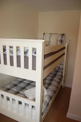 a bunk bed room with two bunk beds at Ty Pen y Bryn in Dolgellau in Dolgellau