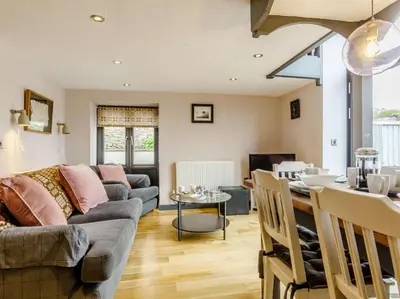 a living room with a couch and a table at 2 Bed in Brecon oc-bn100 in Cray