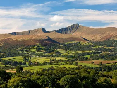 a view of a valley with mountains in the background at 2 Bed in Llanfihangel-nant-Bran BN200 in Llanfihangel-Nant-Brân
