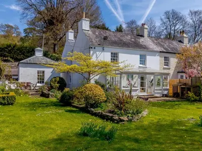 an exterior view of a white house with a yard at 3 Bed in Brecon oc-bn331 in Cathedine