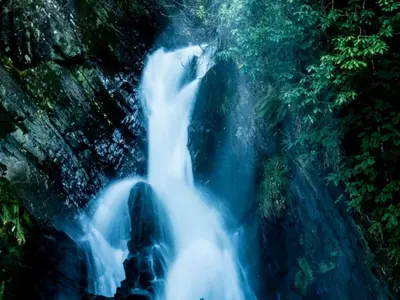 an aerial view of a waterfall in a forest at 1 Bed in Aberystwyth oc-83551 in Llanilar