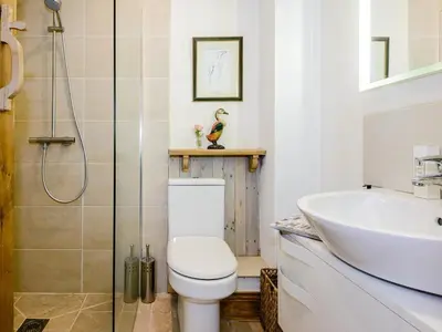 a bathroom with a toilet and a sink at 4 Bed in Llandinam oc-51651 in Llandinam