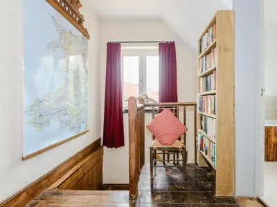 a hallway with a chair and a window at 4 Bed in Llandinam oc-51651 in Llandinam