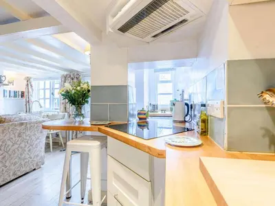 a kitchen with a counter top and a table at 1 Bed in Presteigne oc-53667 in Presteigne