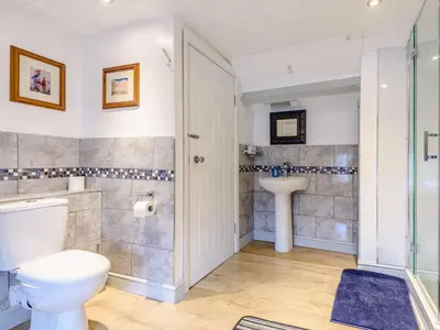 a bathroom with a toilet and a sink at 1 Bed in Presteigne oc-53667 in Presteigne
