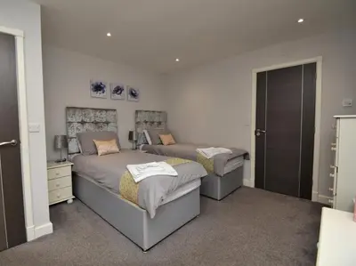 a bedroom with two beds in a room at 4 Bed in Oswestry oc-74110 in Kinnerley