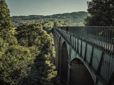 a bridge in the middle of a forest at 2 Bed in Corwen oc-77351 in Corwen