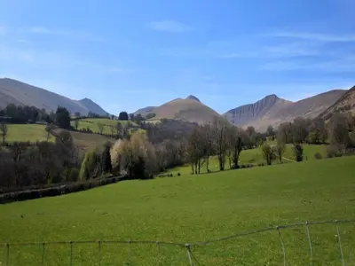 a field of green grass with mountains in the background at 1 Bed in Brecon oc-bn264 in Brecon