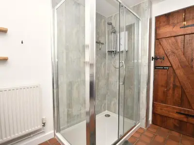 a shower with a glass door in a bathroom at 1 Bed in Brecon oc-bn264 in Brecon