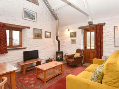 a living room with a couch and a fireplace at 1 Bed in Brecon oc-bn264 in Brecon