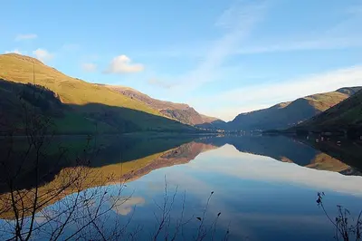 a view of a lake in the middle of a valley at Glan yr Afon in Dolgellau in Dolgellau