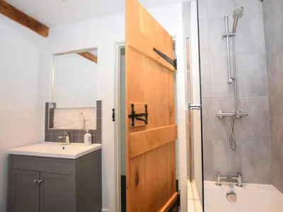 a bathroom with a sink and a shower at 3 Bed in Brecon oc-88249 in Brecon