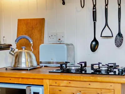 a kitchen counter with a tea kettle and a toaster at 1 Bed in Llanidloes oc-56492 in Van