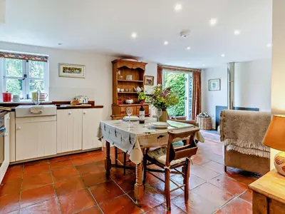 a kitchen with a wooden table and a table sidx sidx sidx at 1 Bed in Brecon oc-bn157 in Llangorse