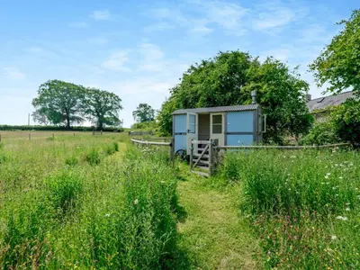 a tiny house in the middle of a field at 1 Bed in Clyro BN290 in Clyro