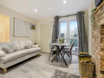 a living room with a couch and a table at Brewers Cottage-Uk45454 in Montgomery