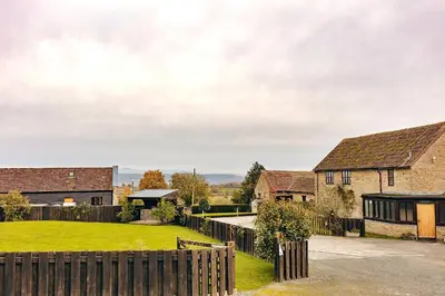 a row of houses with a yard at Finest Retreats - The Park in Onibury