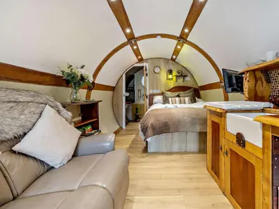 a large room with two beds and a couch at 1 Bed in Llanidloes oc-81415 in Van