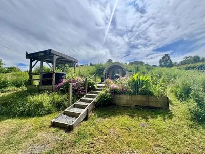 a garden with a gazebo and some flowers at 1 Bed in Llanidloes oc-81415 in Van