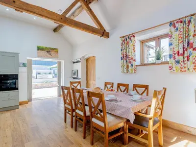 a kitchen and dining room with a table and chairs at 4 Bed in Church Stretton oc-87695 in Cardington