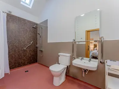 a bathroom with a toilet and a sink at 4 Bed in Church Stretton oc-87695 in Cardington