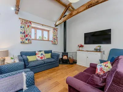 a living room with two couches and a tv at 4 Bed in Church Stretton oc-87695 in Cardington